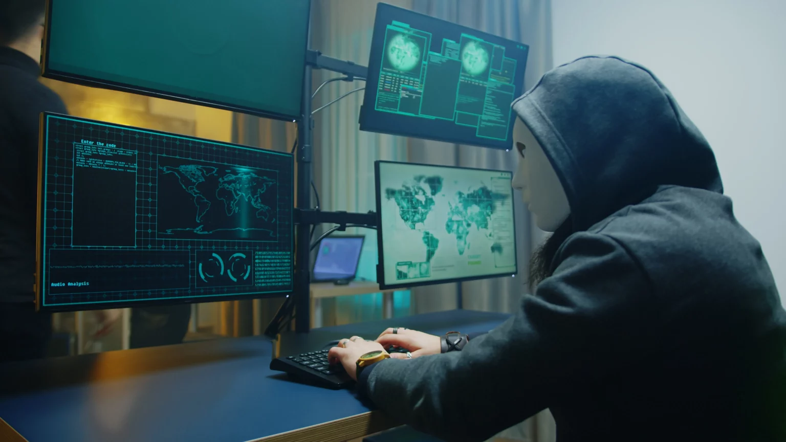 side-view-of-masked-hacker-writing-a-dangerous-mal-2022-03-31-23-19-26-utc – Synergos Consultancy